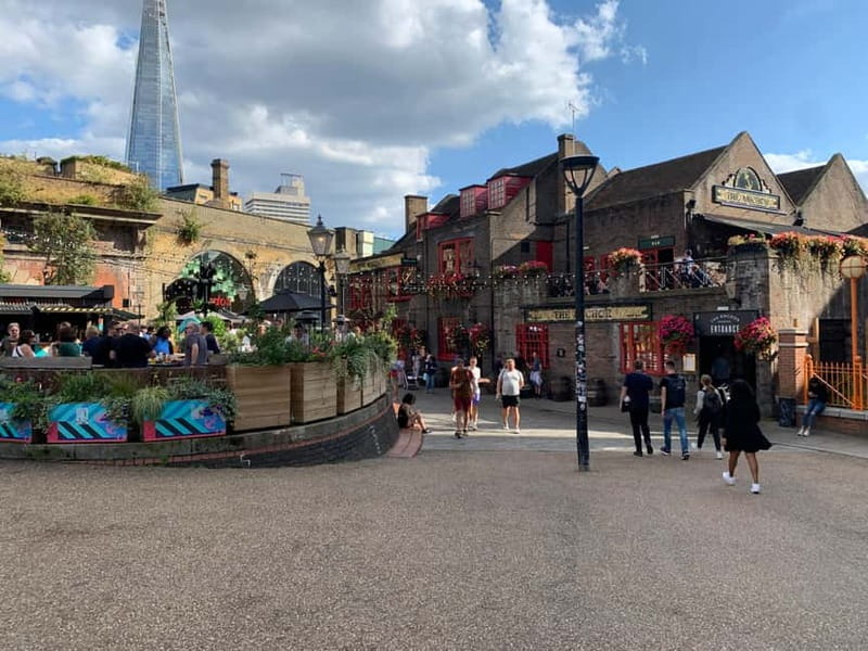 Lights, Camera, London! Movie Locations Walking Tour - From Eros Fountain With an Orange Umbrella