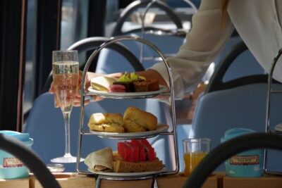 London Afternoon Tea Bus and Panoramic Tour on Lower Deck - Lower-Deck Seating, Shared Tables, and Real-World Views