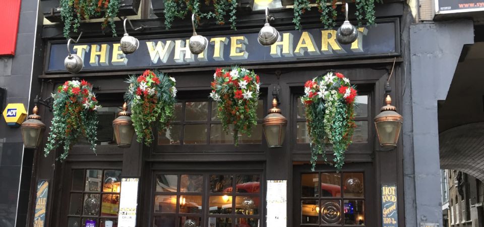 London: Jack the Ripper Walking Tour with an App - Big educational buildings and street entrances: Old Board School, Working Lads Institute, and Wood’s Building